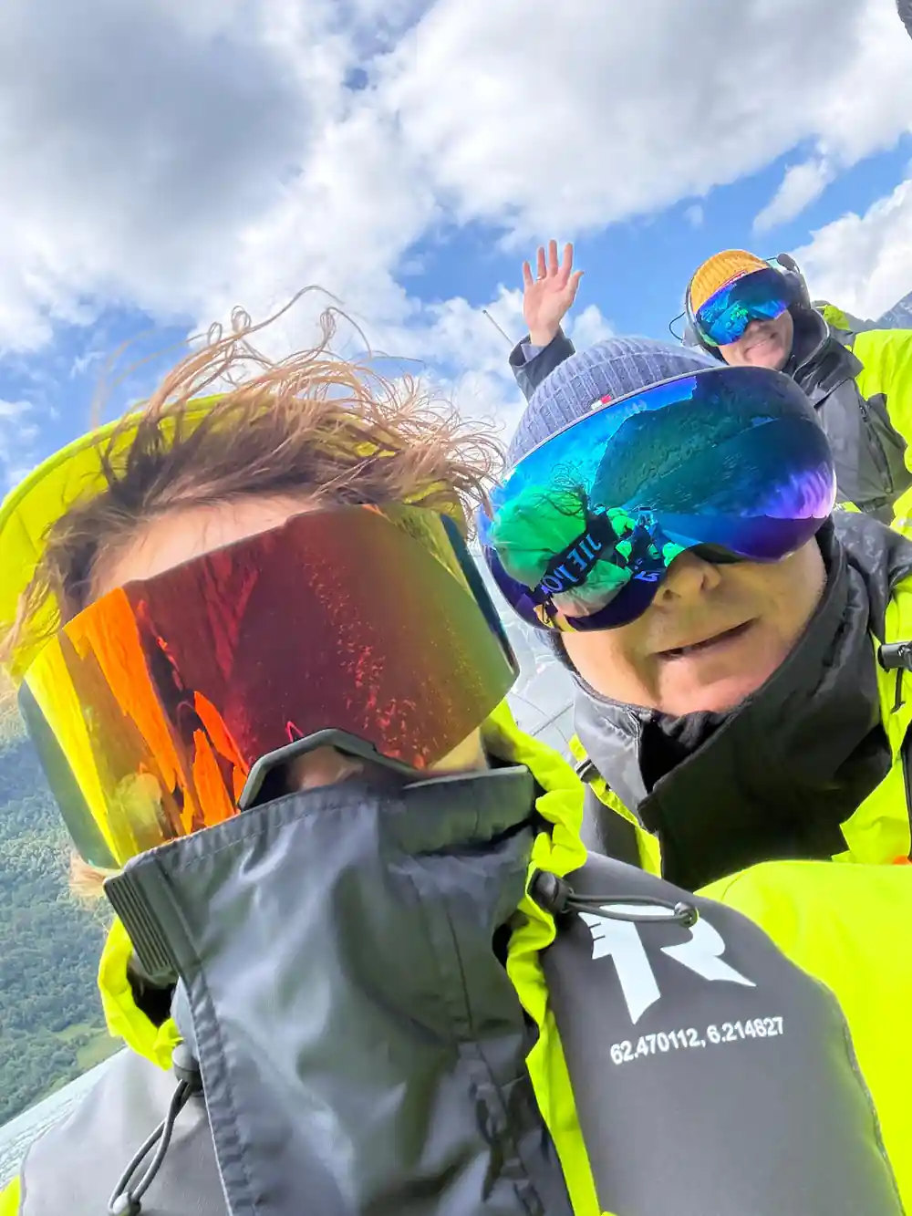 Two passengers in mirrored goggles close to the camera on the boat